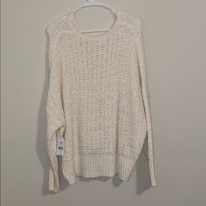 sweater needs something worn underneath